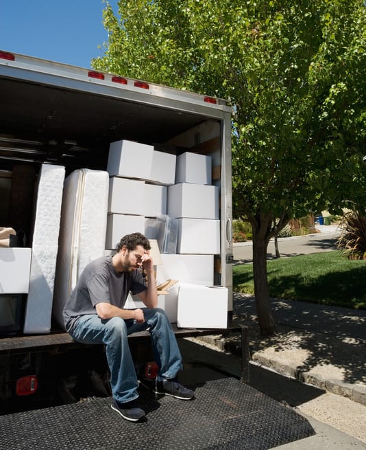 Smooth Move Moving Services in South Carolina | man sitting on end of moving truck