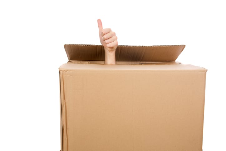 Smooth Move Moving Services in South Carolina | man's hand sticking up out of box giving thumbs up sign